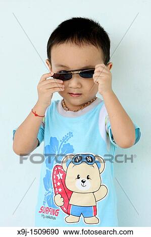 Portrait of a boy with funny face View Large Photo Image Stock Image - Portrait of a boy with funny face. Fotosearch
