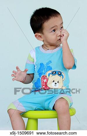 Portrait of a boy with funny face View Large Photo Image Stock Image - Portrait of a boy with funny face. Fotosearch