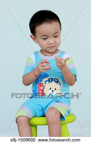 Portrait of a boy with funny face View Large Photo Image Stock Image - Portrait of a boy with funny face. Fotosearch