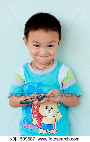 Stock Photo - Portrait of a boy with funny face. Fotosearch