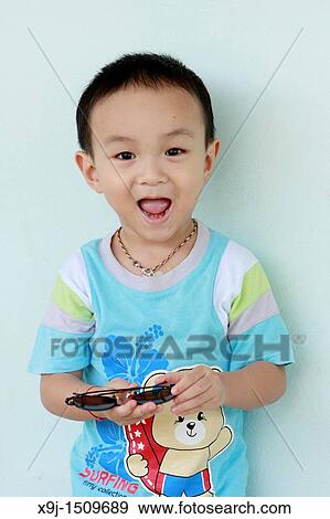 Portrait of a boy with funny face View Large Photo Image Stock Photo - Portrait of a boy with funny face. Fotosearch