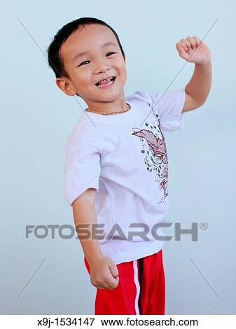 Stock Photo - Portrait of a boy with funny face. Fotosearch