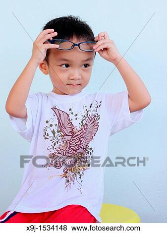 Portrait of a boy with funny face View Large Photo Image Stock Photo - Portrait of a boy with funny face. Fotosearch