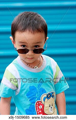 Portrait of a boy with funny face View Large Photo Image Stock Photography - Portrait of a boy with funny face. Fotosearch