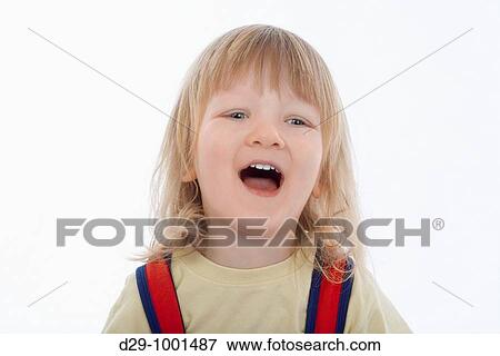 Stock Photo - portrait of a boy with long blond hair laughing. Fotosearch