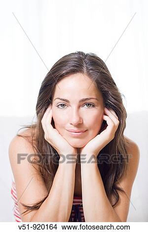 Portrait of a brunette woman at home View Large Photo Image Picture - Portrait of a brunette woman at home. Fotosearch