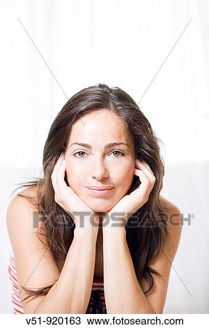 Portrait of a brunette woman at home View Large Photo Image Stock Image - Portrait of a brunette woman at home. Fotosearch