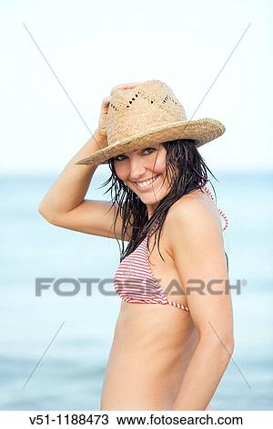 Portrait of a brunette woman smiling at camera at the beach in Ibiza, Balearic Islands View Large Photo Image Stock Image - Portrait of a brunette woman smiling at camera at the beach in Ibiza, Balearic Islands. Fotosearch