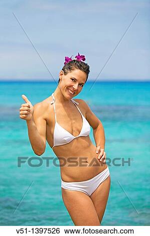 Portrait of a content brunette woman at the beach View Large Photo Image Stock Photograph - Portrait of a content brunette woman at the beach. Fotosearch