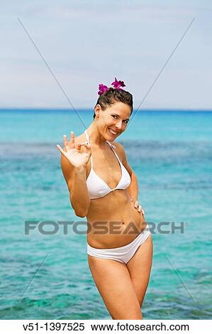 Portrait of a content brunette woman at the beach View Large Photo Image Stock Photography - Portrait of a content brunette woman at the beach. Fotosearch