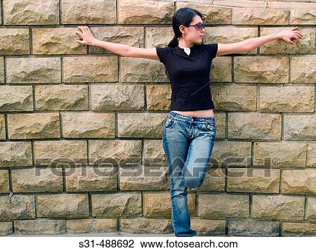 Stock Image - Portrait of a cool Chinese girl smiling at the camera. Fotosearch