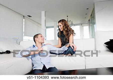 Portrait of a couple at home chilling out View Large Photo Image Stock Image - Portrait of a couple at home chilling out. Fotosearch