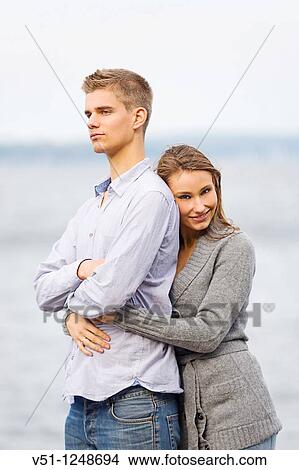 Picture - Portrait of a couple holding by the sea. Fotosearch
