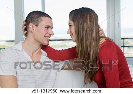 Portrait of a couple in love in sofa View Large Photo Image Stock Image - Portrait of a couple in love in sofa. Fotosearch
