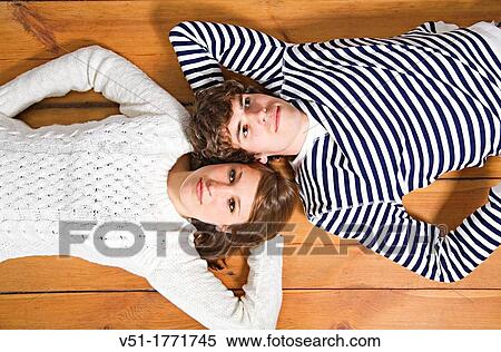 Stock Photography - Portrait of a couple looking at the sky. Fotosearch