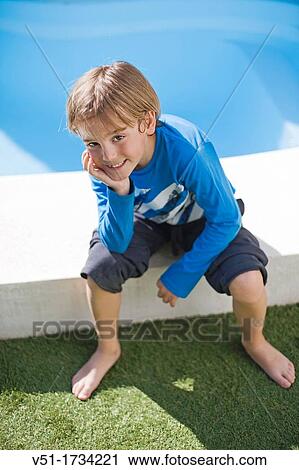 Portrait of a cute boy by the pool smiling at camera View Large Photo Image Stock Image - Portrait of a cute boy by the pool smiling at camera. Fotosearch