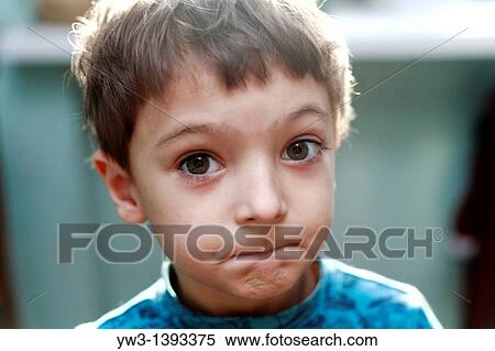 Stock Photography - Portrait of a cute little boy grimasing. Fotosearch