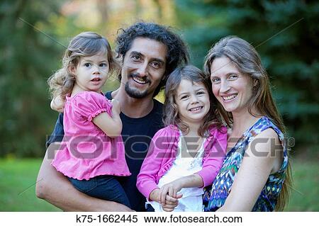 Portrait of a family of four View Large Photo Image Stock Photography - Portrait of a family of four. Fotosearch