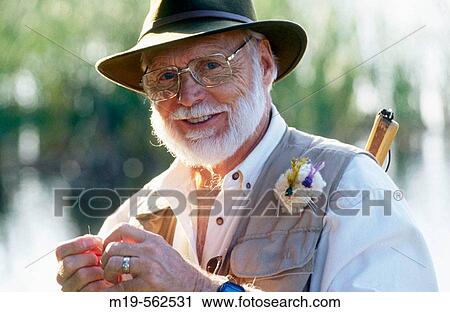 Stock Image - portrait of a fly fisherman. Fotosearch