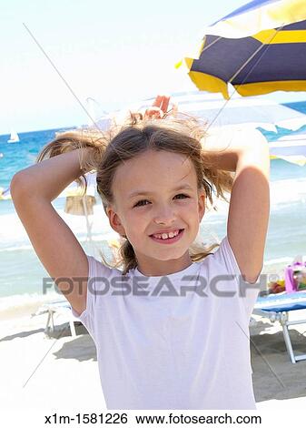 Portrait of a girl on the beach View Large Photo Image Stock Photograph - Portrait of a girl on the beach. Fotosearch