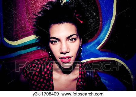 Portrait of a girl with a graffiti background. View Large Photo Image Stock Photo - Portrait of a girl with a graffiti background.. Fotosearch