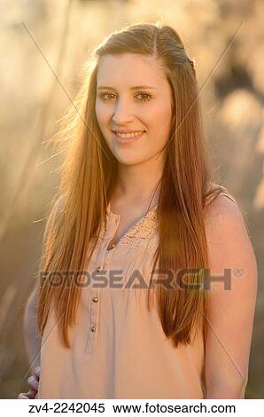 Portrait of a good looking young woman in early spring. View Large Photo Image Stock Photography - Portrait of a good looking young woman in early spring.. Fotosearch