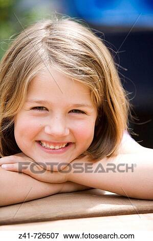 Portrait of a happy little girl View Large Photo Image Stock Photo - Portrait of a happy little girl. Fotosearch