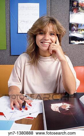 portrait of a happy teenage girl as she works at her desk View Large Photo Image Stock Photo - portrait of a happy teenage girl as she works at her desk. Fotosearch