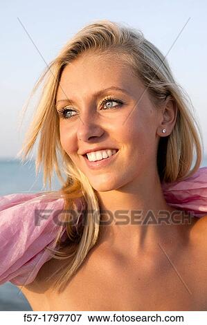 Portrait of a healthy young woman at the beach View Large Photo Image Stock Photo - Portrait of a healthy young woman at the beach. Fotosearch