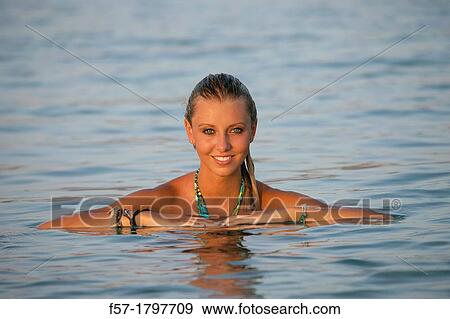 Portrait of a healthy young woman at the beach View Large Photo Image Stock Photo - Portrait of a healthy young woman at the beach. Fotosearch