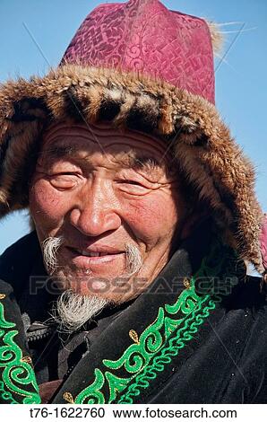 Stock Image - portrait of a Kazakh eagle hunter in the Altai Region of Bayan-? lgii in Western Mongolia. Fotosearch