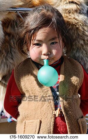 Stock Image - portrait of a Kazakh girl in the Altai Region of Bayan-? lgii in Western Mongolia. Fotosearch