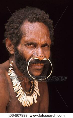 Stock Photo - Portrait of a Koroway man wearing a nose adornment made of casoar bones, Western Papuasia, former Irian-jaya, Indonesia. Fotosearch