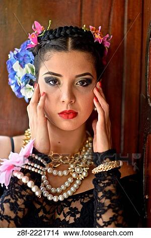 Portrait of a Latin woman inspired by the figure of Mexican painter Frieda Kahlo. View Large Photo Image Picture - Portrait of a Latin woman inspired by the figure of Mexican painter Frieda Kahlo.. Fotosearch