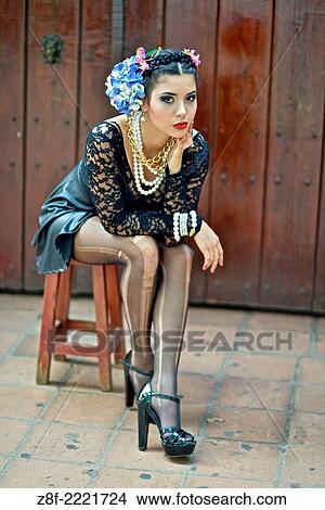 Picture - Portrait of a Latin woman inspired by the figure of Mexican painter Frieda Kahlo.. Fotosearch