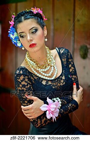 Portrait of a Latin woman inspired by the figure of Mexican painter Frieda Kahlo. View Large Photo Image Stock Photograph - Portrait of a Latin woman inspired by the figure of Mexican painter Frieda Kahlo.. Fotosearch