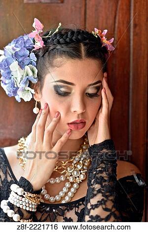 Portrait of a Latin woman inspired by the figure of Mexican painter Frieda Kahlo. View Large Photo Image Stock Photograph - Portrait of a Latin woman inspired by the figure of Mexican painter Frieda Kahlo.. Fotosearch