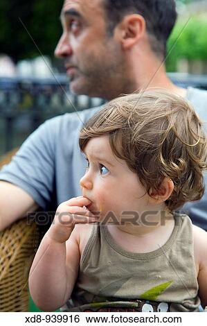 Stock Photograph - portrait of a little boy with his father. Fotosearch