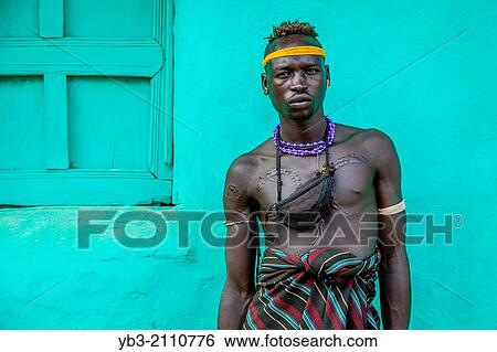 Portrait Of A Man From The Mursi Tribe, Jinka, Omo Valley, Ethiopia. View Large Photo Image Stock Photograph - Portrait Of A Man From The Mursi Tribe, Jinka, Omo Valley, Ethiopia.. Fotosearch
