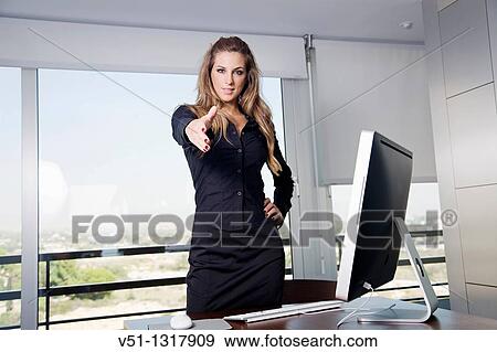 Portrait of a manager woman in her workplace View Large Photo Image Stock Photo - Portrait of a manager woman in her workplace. Fotosearch