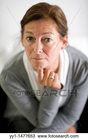 Portrait of a middle-aged woman, working as a secretary / management assistant. Studio-portait. View Large Photo Image Stock Image - Portrait of a middle-aged woman, working as a secretary / management assistant. Studio-portait.. Fotosearch