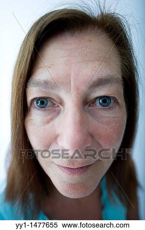 Portrait of a middle-aged woman with red hear. View Large Photo Image Stock Photography - Portrait of a middle-aged woman with red hear.. Fotosearch