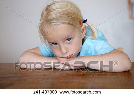 Portrait of a moody blond girl View Large Photo Image Stock Image - Portrait of a moody blond girl. Fotosearch