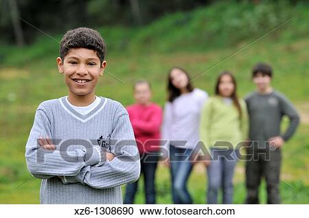 Portrait of a Moroccan boy, his friends in the background. Spain. View Large Photo Image Stock Image - Portrait of a Moroccan boy, his friends in the background. Spain.. Fotosearch