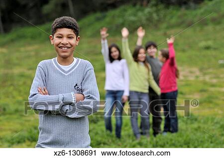 Portrait of a Moroccan boy, his friends in the background. Spain. View Large Photo Image Stock Image - Portrait of a Moroccan boy, his friends in the background. Spain.. Fotosearch