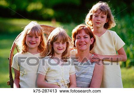 Portrait of a mother and her three daughter View Large Photo Image Stock Image - Portrait of a mother and her three daughter. Fotosearch