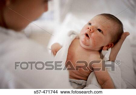 portrait of a new born baby-girl (two days old) with her mother View Large Photo Image Picture - portrait of a new born baby-girl (two days old) with her mother. Fotosearch