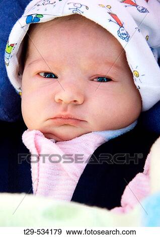 Stock Photo - Portrait of a newborn girl. Fotosearch