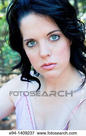 Portrait of a nineteen year old brunette woman looking at the camera View Large Photo Image Stock Photo - Portrait of a nineteen year old brunette woman looking at the camera. Fotosearch