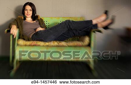 Portrait of a nineteen year old brunette woman looking at the camera sitting on a glider View Large Photo Image Stock Photograph - Portrait of a nineteen year old brunette woman looking at the camera sitting on a glider. Fotosearch